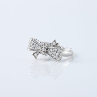 Round Cut Moissanite Diamond Bow Tie Ring in 18K White Gold